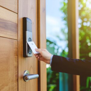 November 19_untagged A modern, high-tech office security system setup featuring AI-powered surveillance cameras, multiple monitoring screens displaying abstract visuals, and access control systems with biometric scanners. The sleek environment highlights advanced security system upgrades and emergency response solutions, showcasing a futuristic and secure workspace.