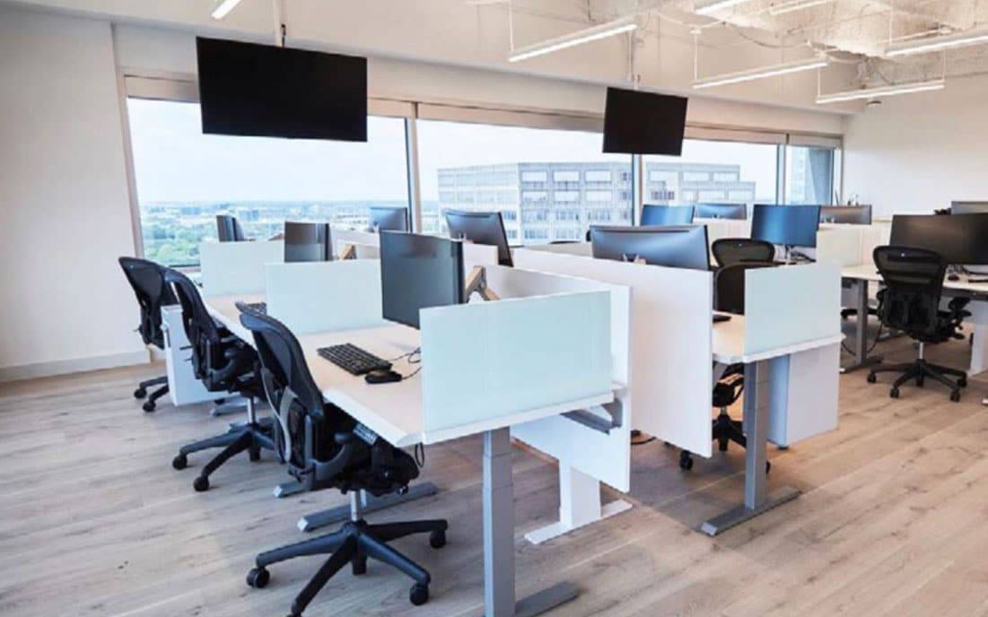 Desks and mounted displays in an open office concept