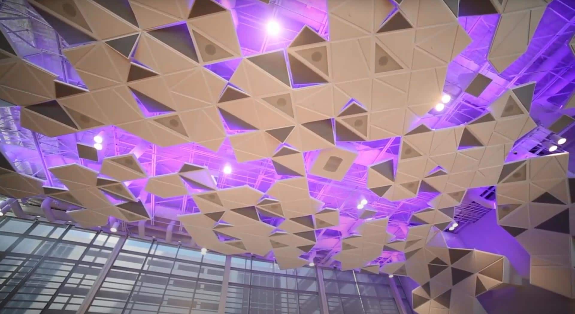 Purple fiber optic lighting at a conference.