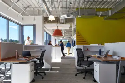 Workspace with laptops, power strips, and data cabling