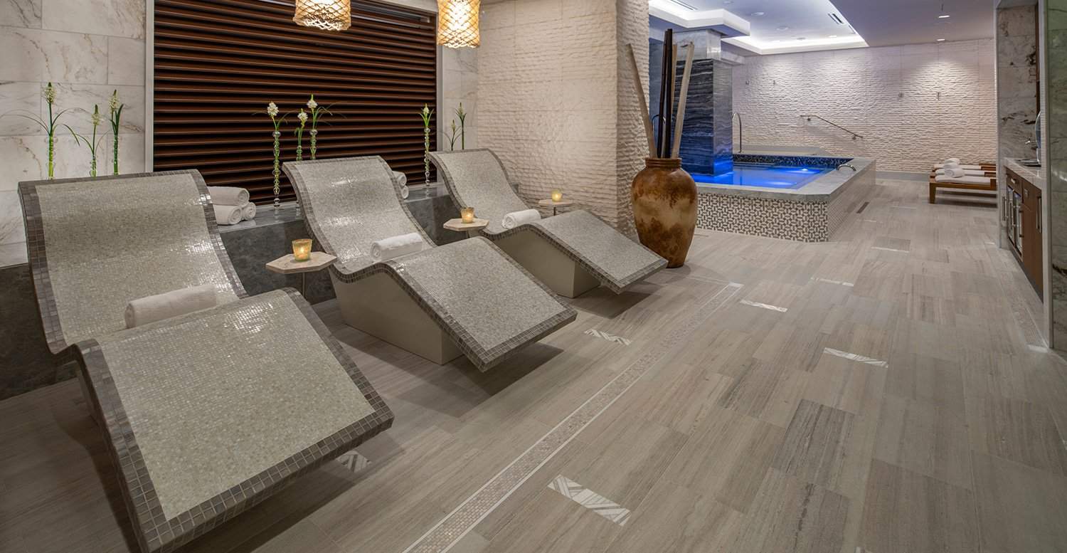 Curved ceramic chairs inside an elegant hotel spa.