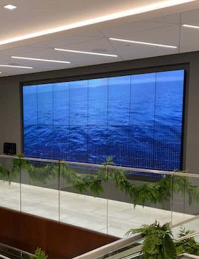Large video wall in the main lobby of a corporate office.