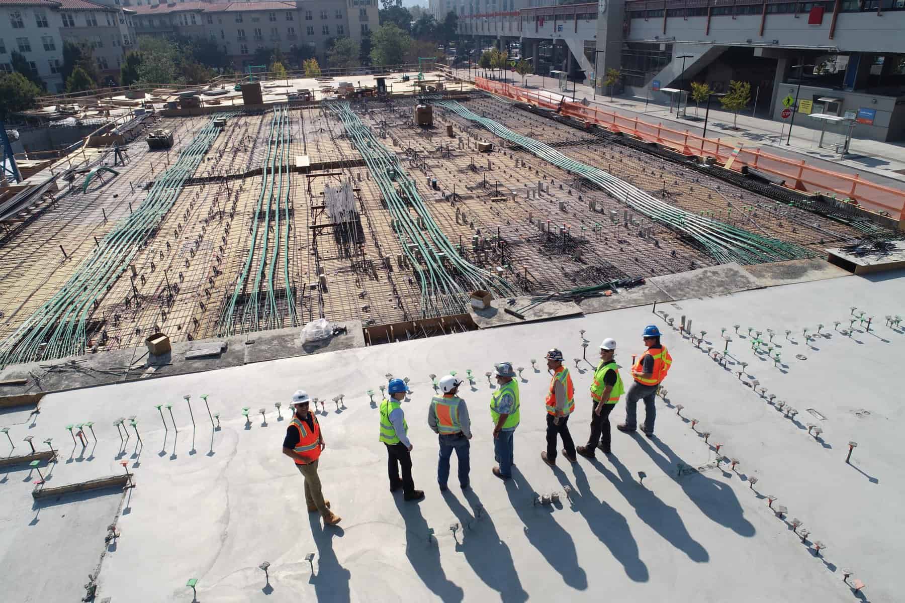 Real estate consultants looking at the construction site of a new commercial building.