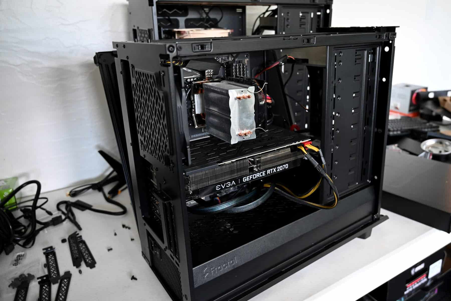 A computer opened up for preventative maintenance to be performed by an IT profressional.