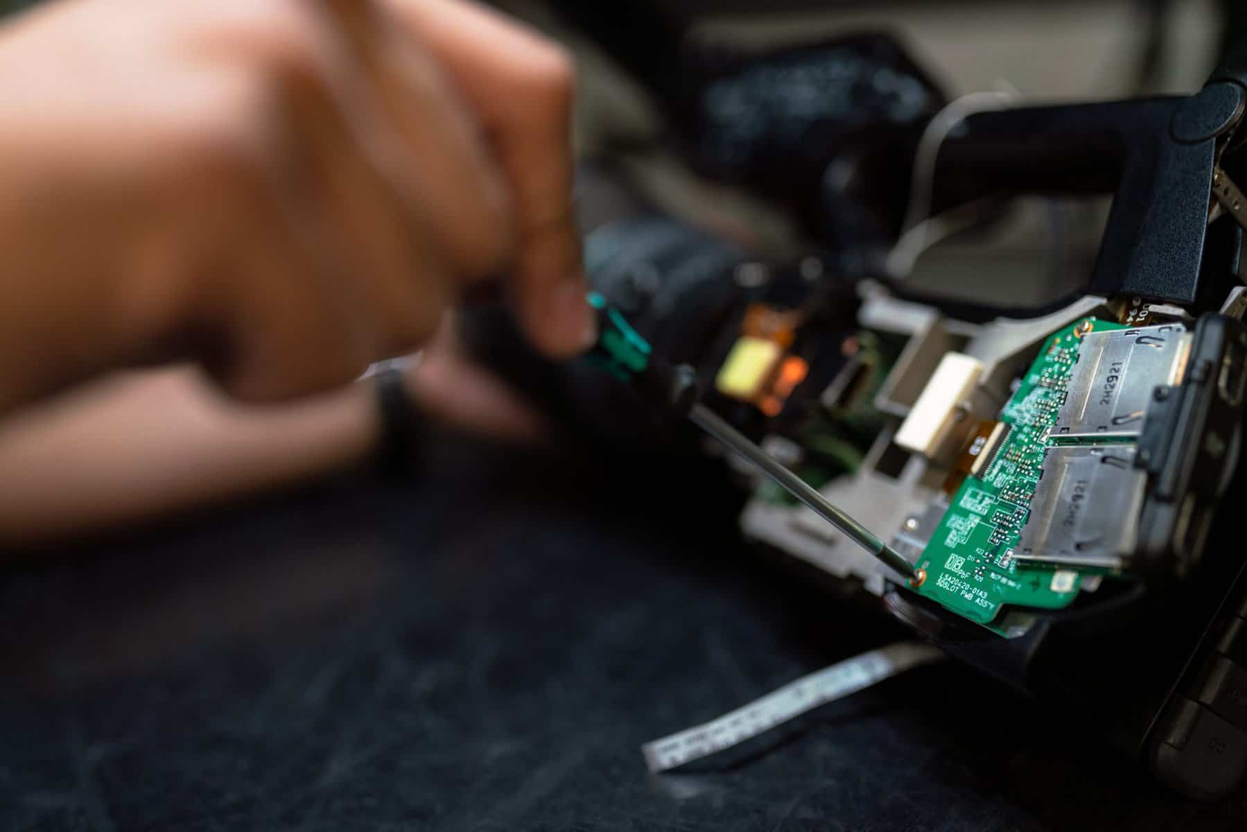 IT professional working on a motherboard of a computer