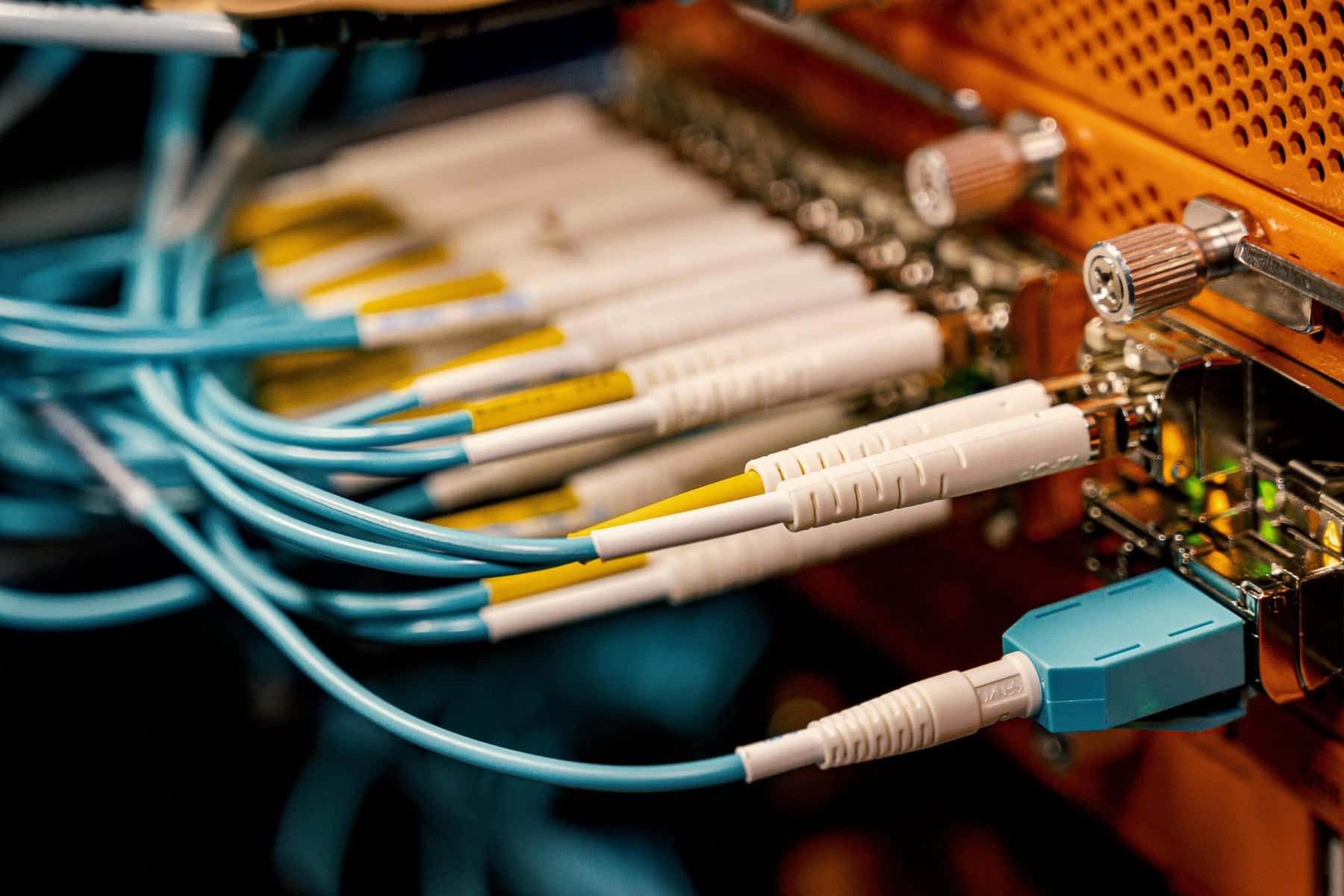 Fiber optic cabling being installed in a server room at an office.