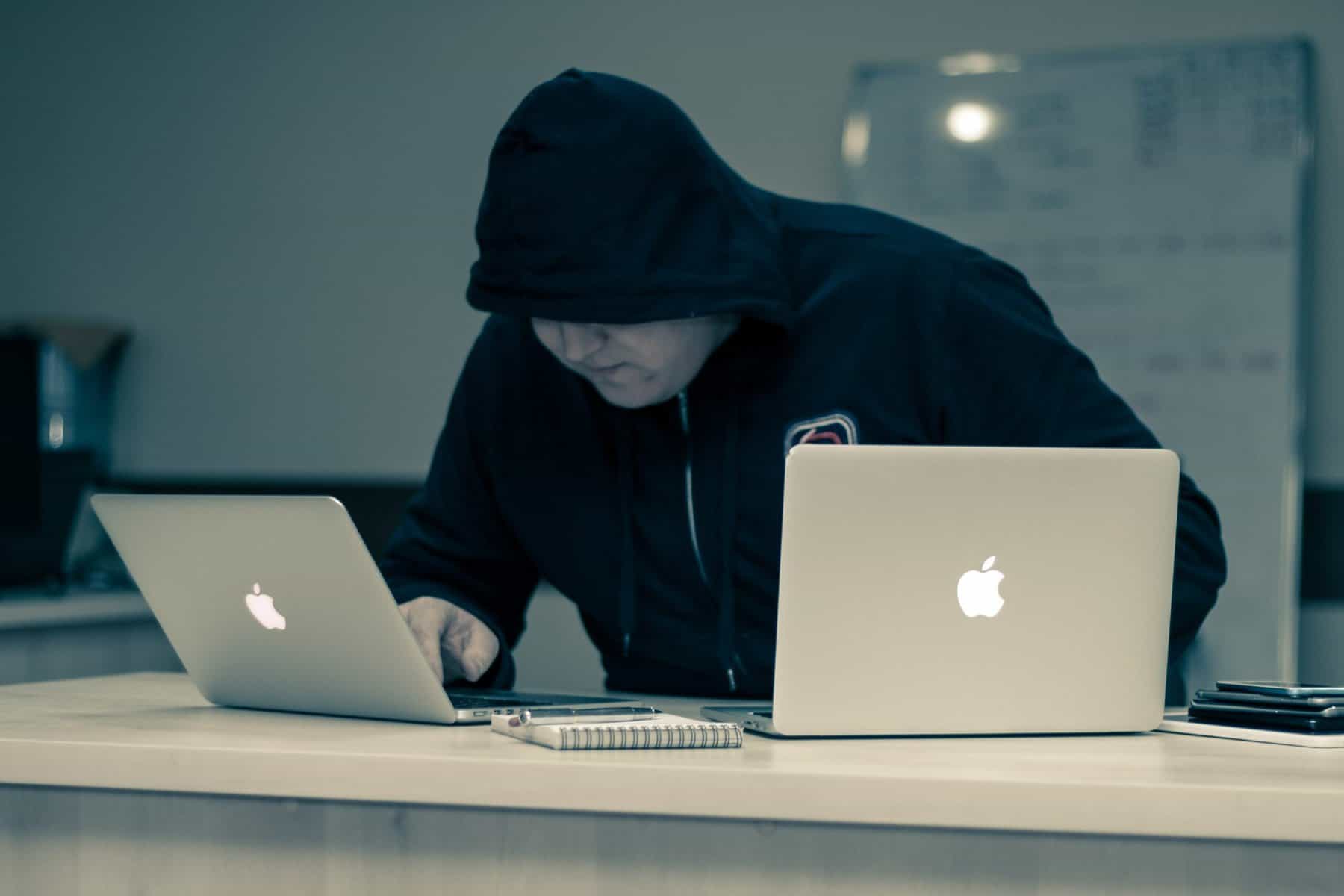 A hacker that has broken into an office building.