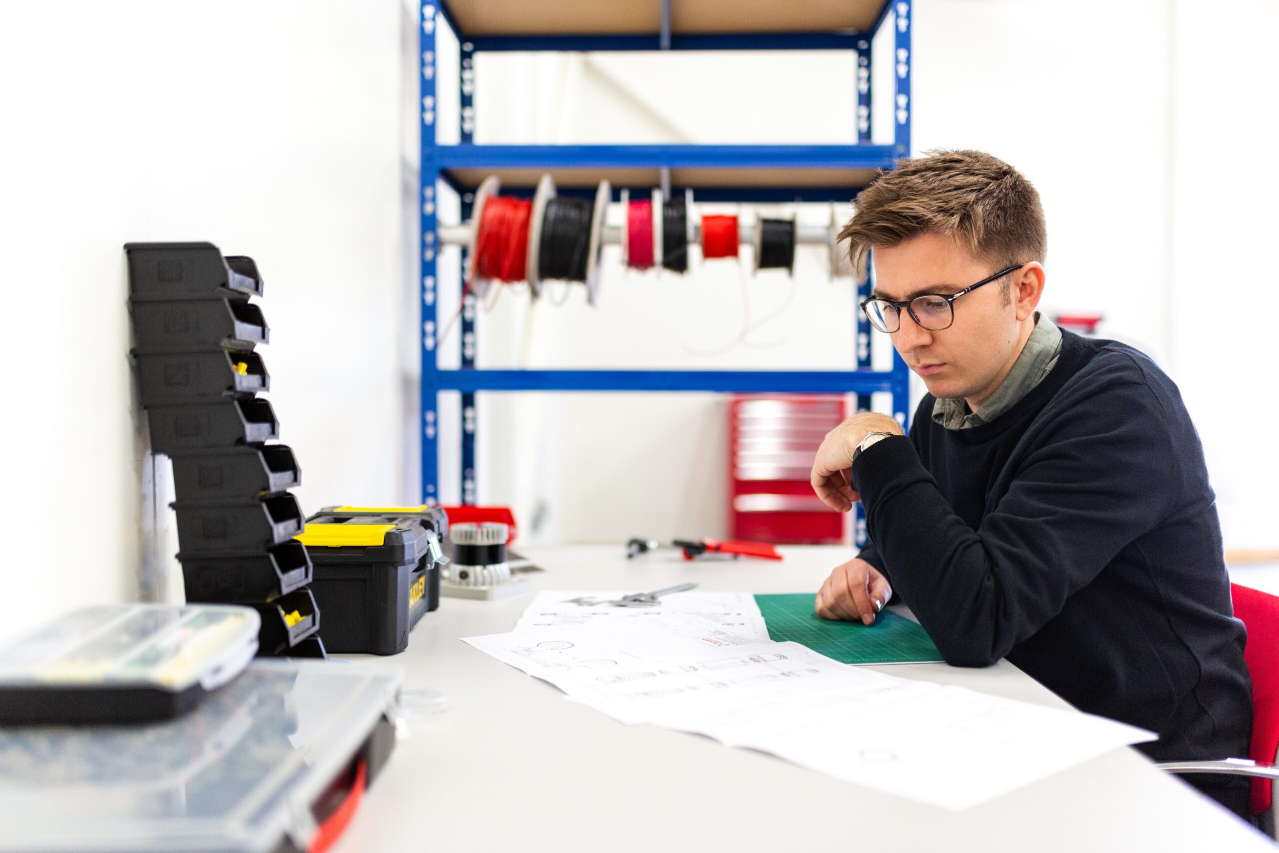 An engineer working on a system architecture diagram.